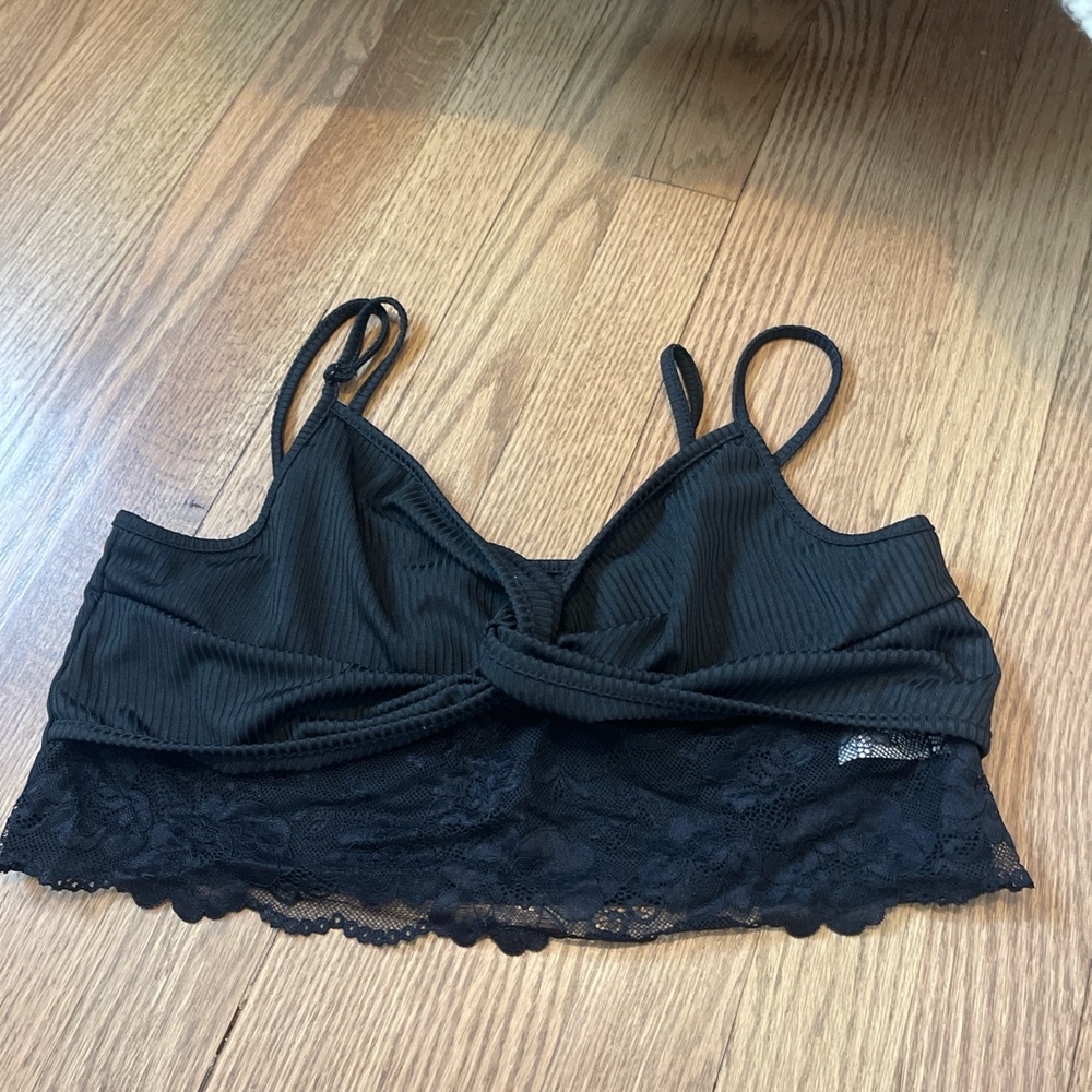 black lace top with adjustable straps . in good condition and size is XL.